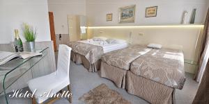 Postel nebo postele na pokoji v ubytování Anette Hotel