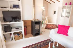 a living room with a white couch and a fireplace at Casa Bella Vista in Moraira