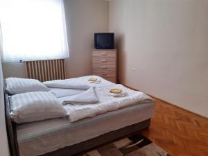 Posteľ alebo postele v izbe v ubytovaní Pipacs Vendégház Eger