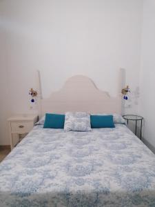 A bed or beds in a room at CARBALLO DE PRADO 1900