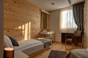 Rúm í herbergi á Hotel Žabljak