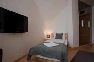 Rúm í herbergi á Hotel Žabljak