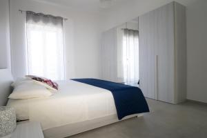 Postel nebo postele na pokoji v ubytování Tra Sole e Mare