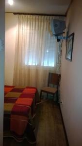 Posteľ alebo postele v izbe v ubytovaní Hostal Patrón