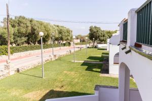 a view of a street with street lights on the grass at Apartamento SARAY in Son Carrio