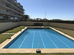 a swimming pool on the roof of a building at Beachfront Apartment with Swimming Pool in Mindelo