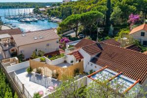 an aerial view of a house with a marina at Matanovi dvori in Milna