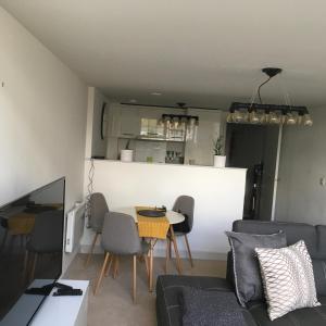 a living room with a couch and a table at The Old Railway Quarter in Swindon