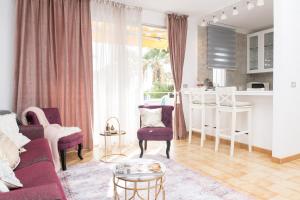 a living room with a couch and a table at Adults Only Sunny Quiet Apartment in Center of Las Americas in Arona