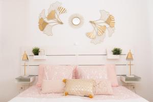 a bedroom with a pink bed with butterflies on the wall at Adults Only Sunny Quiet Apartment in Center of Las Americas in Arona +42 photos