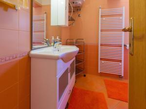 a bathroom with a sink and a mirror at Apartments Milica in Crikvenica +58 photos