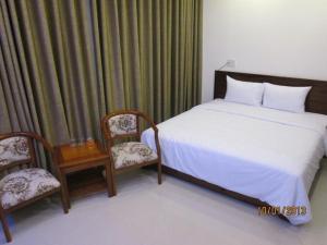 Postel nebo postele na pokoji v ubytování Apogee Hotel
