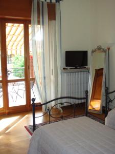 Кровать или кровати в номере Cà 'd Peraca