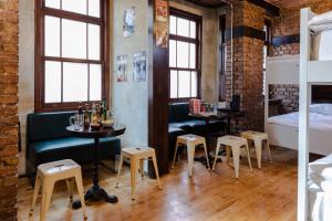 a room with a bar with a table and stools at Sanat Hostel Taksim in Istanbul