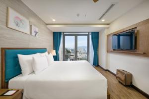 Giường trong phòng chung tại White Sand Boutique Hotel