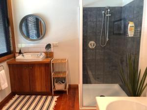 a bathroom with a shower and a sink and a tub at Twizel -Northwest Retreat in Twizel +17 photos