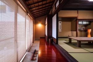 a hallway of a room with a table and a table at Kimachi-tei（きまち亭） in Toyama