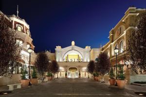 a large building with a courtyard at night at River City Casino and Hotel in Lemay