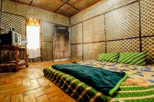 Postel nebo postele na pokoji v ubytování Larasati Homestay