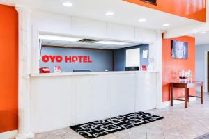 a lobby with a two hotel sign on the wall at OYO Hotel Texarkana Trinity AR Hwy I-30 in Texarkana