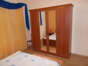 Postel nebo postele na pokoji v ubytování Apartments Makaus