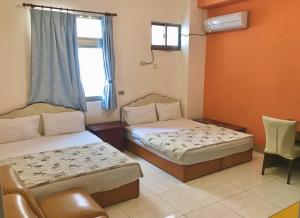 Postel nebo postele na pokoji v ubytování Fu Yuan B&B