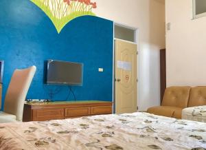 Vuode tai vuoteita majoituspaikassa Fu Yuan B&B