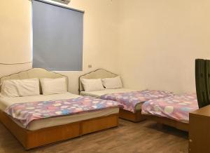 Vuode tai vuoteita majoituspaikassa Fu Yuan B&B