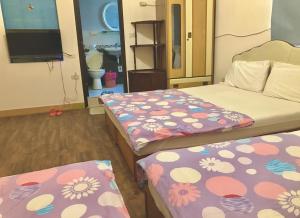 Vuode tai vuoteita majoituspaikassa Fu Yuan B&B