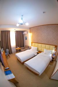 Кровать или кровати в номере Sayyoh Hotel