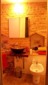 a bathroom with a sink and a toilet at B&B La Lanterna in Fermo