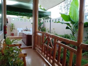 a balcony of a house with a sink at Villa Skanderbeg Guest House in Puerto Princesa City