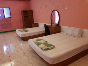 Postel nebo postele na pokoji v ubytování Pthles Guest house