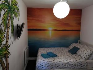 a room with a painting on the wall with a bed at Igloo Hybrid in Nottingham