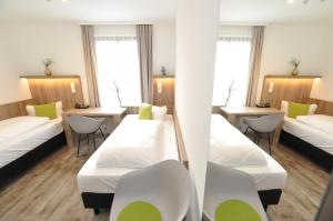 Postel nebo postele na pokoji v ubytování Hotel Perlach Allee by Blattl