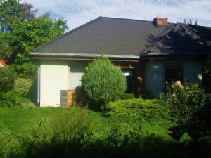 a house with a blue and white at Apartamenty Tabula in Duszniki Zdrój