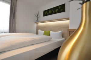 Postel nebo postele na pokoji v ubytování Hotel Perlach Allee by Blattl