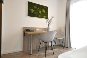 Postel nebo postele na pokoji v ubytování Hotel Perlach Allee by Blattl