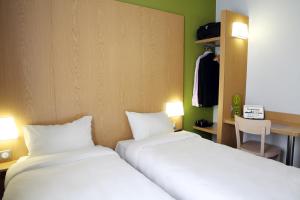 Postel nebo postele na pokoji v ubytování B&B HOTEL Brive-la-Gaillarde