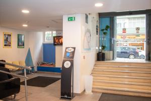 a lobby with a parking meter in front of a store at HI Lisboa - Pousada de Juventude in Lisbon