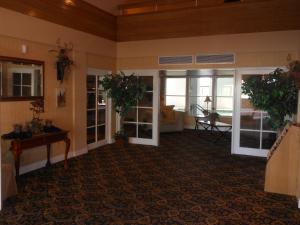 a living room with a couch and a table at Inn of Lompoc in Lompoc