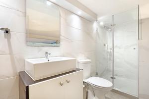 a bathroom with a sink and a toilet and a shower at G Zero 3 @ The Breakers in Hout Bay