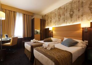 Posteľ alebo postele v izbe v ubytovaní LH Hotel Sirio Venice