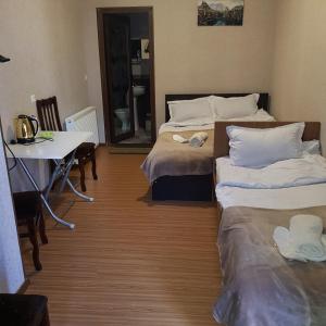 Postel nebo postele na pokoji v ubytování Guesthouse Gia