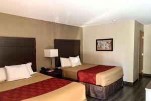 a hotel room with two beds in a room at Econo Lodge City Center in Portland