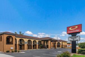 a hotel with a sign in front of a building at Econo Lodge in Gainesville