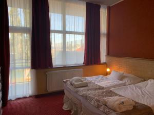Postel nebo postele na pokoji v ubytování Hotel Therma Dunajská Streda