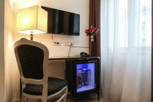 TV a/nebo společenská místnost v ubytování Hotel Assenzio Prague