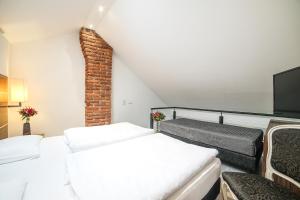 Postel nebo postele na pokoji v ubytování Hotel Assenzio Prague