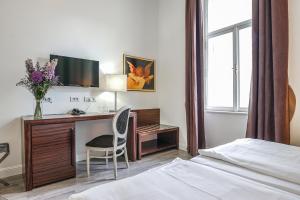 Postel nebo postele na pokoji v ubytování Hotel Assenzio Prague